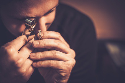 Portrait of a jeweler during the evaluation of jewels. Portrait of a jeweler during the evaluation of jewels.